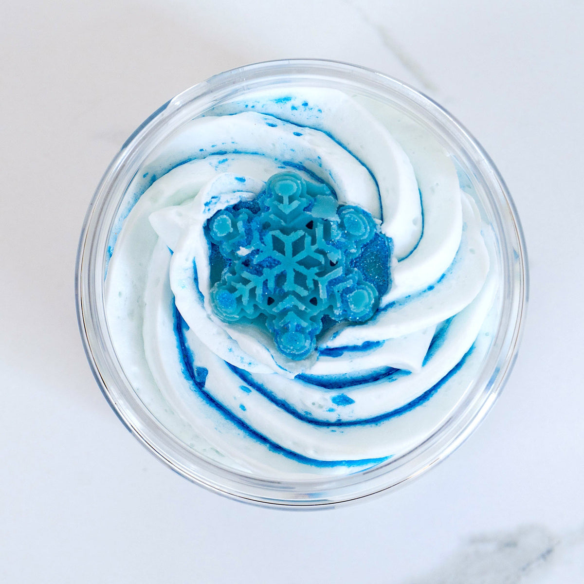 Blue Christmas whipped body butter by Duma Mbili LLC in an 8 oz jar, showcasing its creamy texture and festive holiday theme.