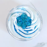 Blue Christmas whipped body butter by Duma Mbili LLC in an 8 oz jar, showcasing its creamy texture and festive holiday theme.