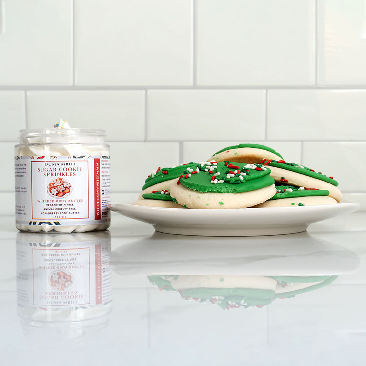 Duma Mbili LLC Sugar Cookie Sprinkles whipped body butter in an 8 oz jar with a creamy texture and colorful sprinkle design.