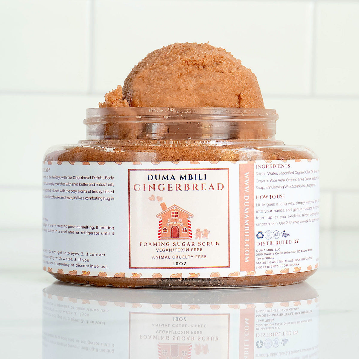 Duma Mbili LLC Gingerbread Foaming Sugar Scrub in a creamy whipped body butter texture, with gingerbread scent visible in the jar.