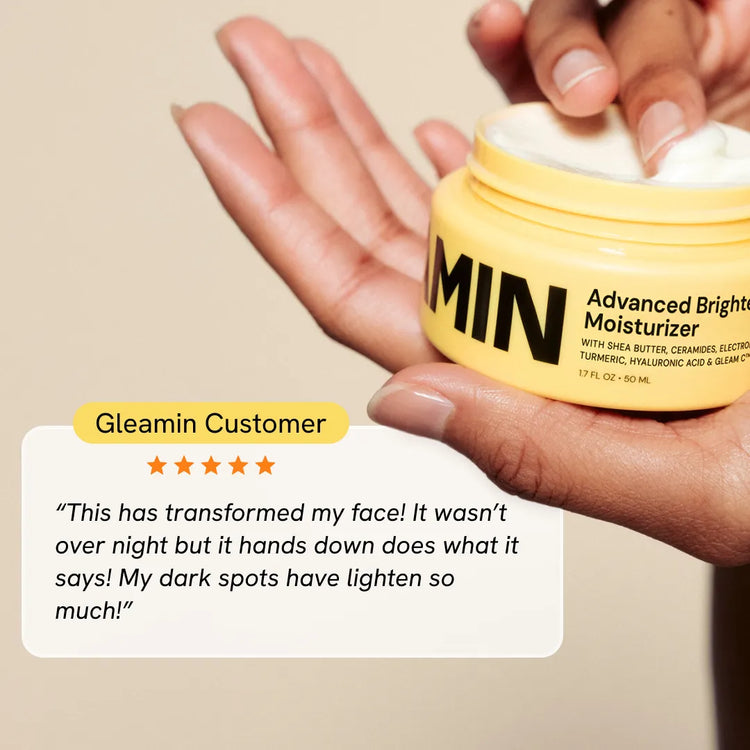 Gleamin Advanced Brightening Facial Moisturizer with smooth cream texture and brightening ingredients in a jar.