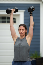 Dark grey Goal Five boxy crop tank top shown on a model, featuring a relaxed fit and sleeveless design.