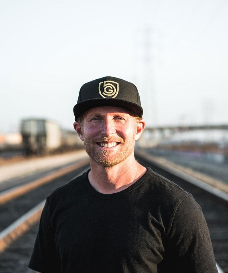 Black Goal Five G5 flat billed snap back hat with a structured crown and adjustable strap, styled for casual lifestyle wear.