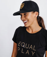 Goal Five G5 flat billed snap back hat in black, lifestyle style, showcasing the structured front and adjustable snap closure.
