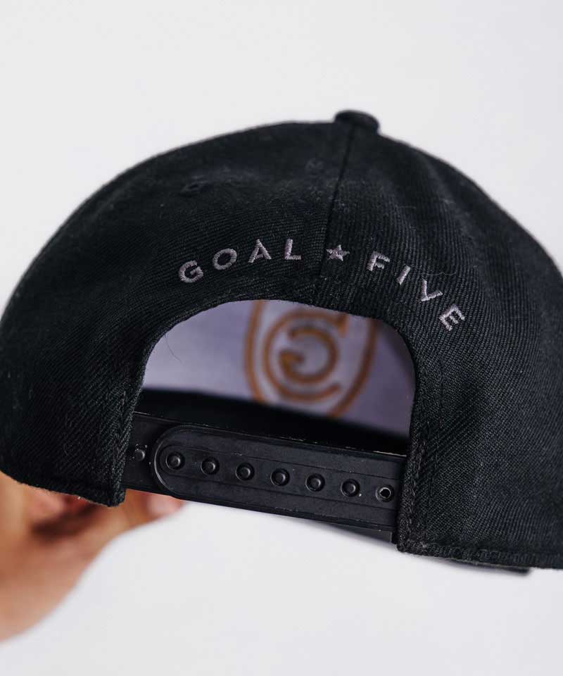 Goal Five G5 Flat Billed Snap Back Hat in black, lifestyle image showcasing the stylish, flat brim design.
