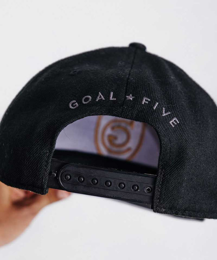 Goal Five G5 Flat Billed Snap Back Hat in black, lifestyle image showcasing the stylish, flat brim design.