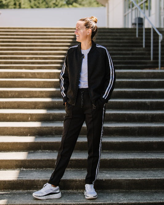 Black Goal Five Powerstripe LS Track Jacket, lifestyle image showing front view with sleek design and sporty fit.