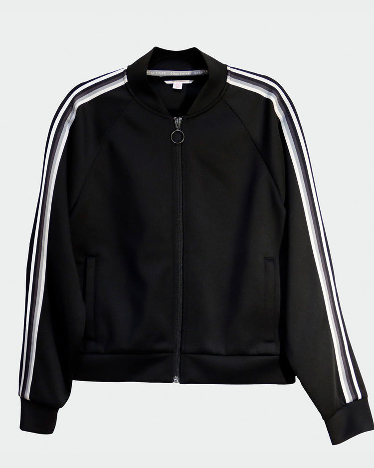 Goal Five Powerstripe LS Track Jacket in black, lifestyle style, shown on a model with front view and sporty design details.