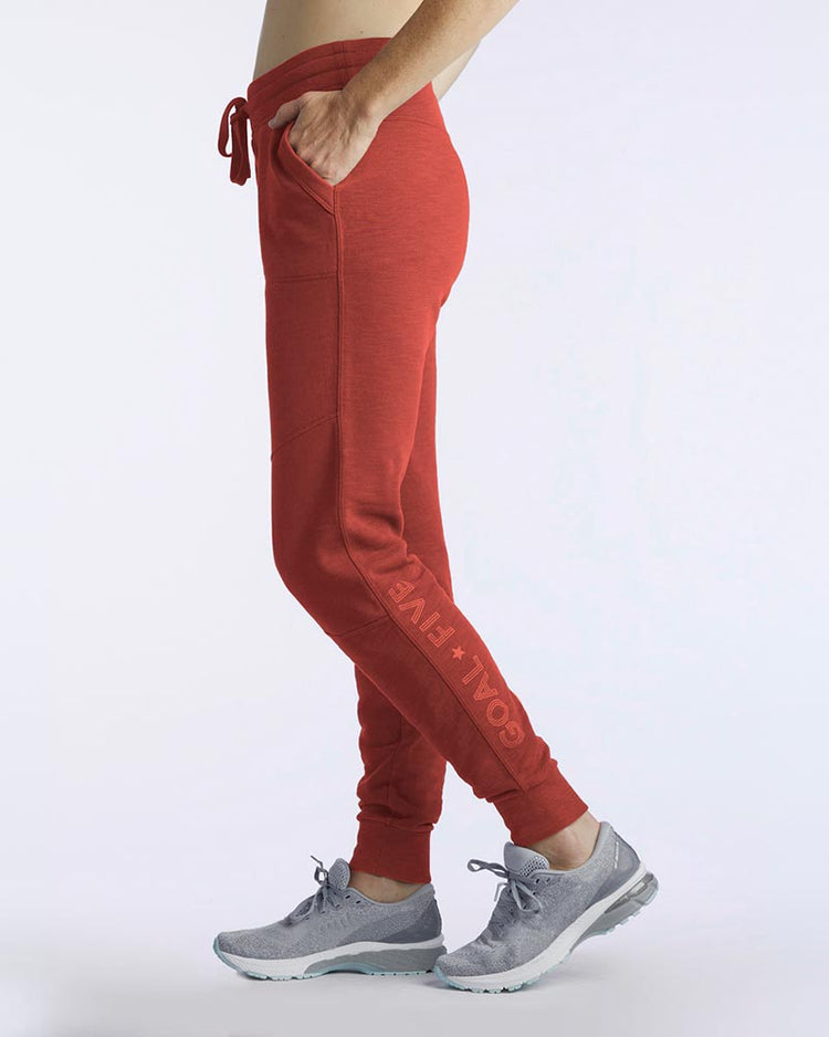 Goal Five Freasy Jogger in carbon color, lifestyle image showing comfortable, tapered athletic joggers with elastic waistband.