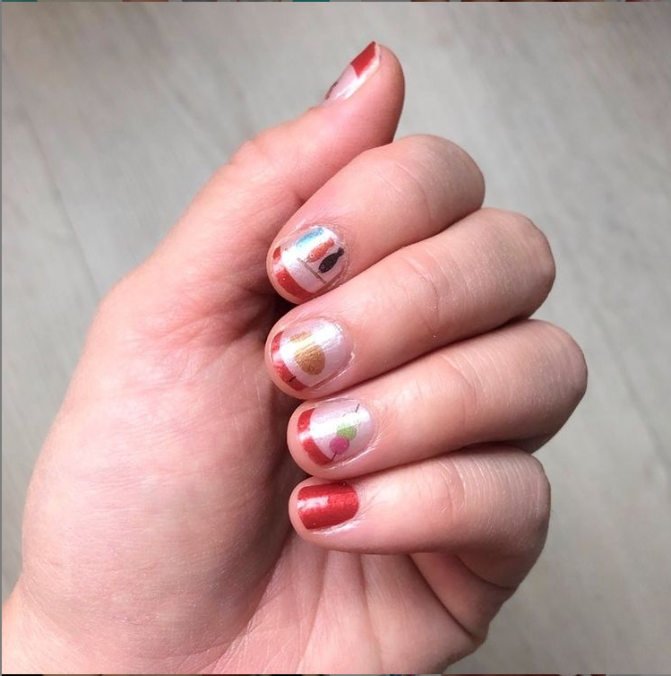 Close-up of Nihon nail strips by Cutie Pop Nail Shop, showcasing colorful and stylish nail art designs on the strips.