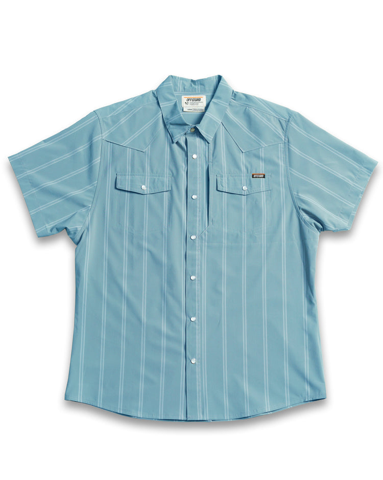 Mid-blue Daryll SS shirt by Off The Grid Surplus, a casual button-up shirt displayed on a hanger.