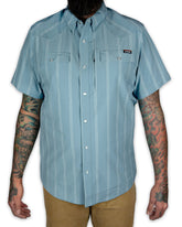 Mid-blue Daryll SS button-up shirt by Off The Grid Surplus, displayed flat showing collar and button details.
