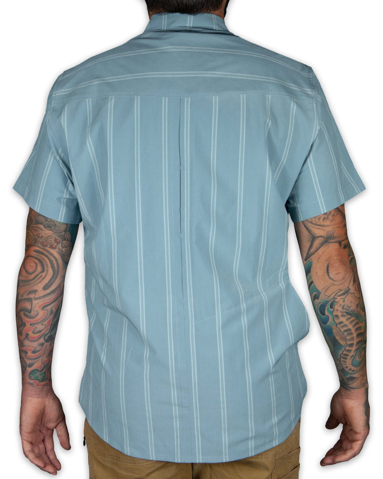 Mid-blue Daryll SS shirt by Off The Grid Surplus, a stylish button-up shirt with a classic fit and casual design.