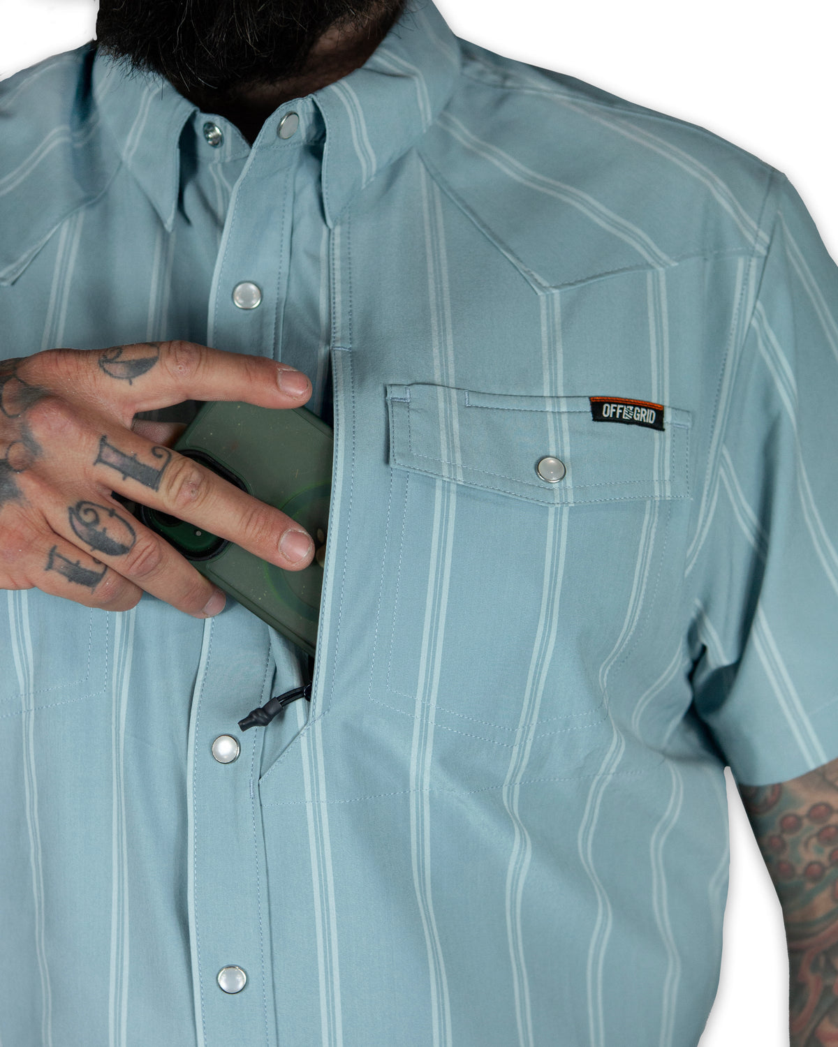 Mid-blue Daryll SS shirt by Off The Grid Surplus, a stylish button-up shirt with a classic fit and casual design.