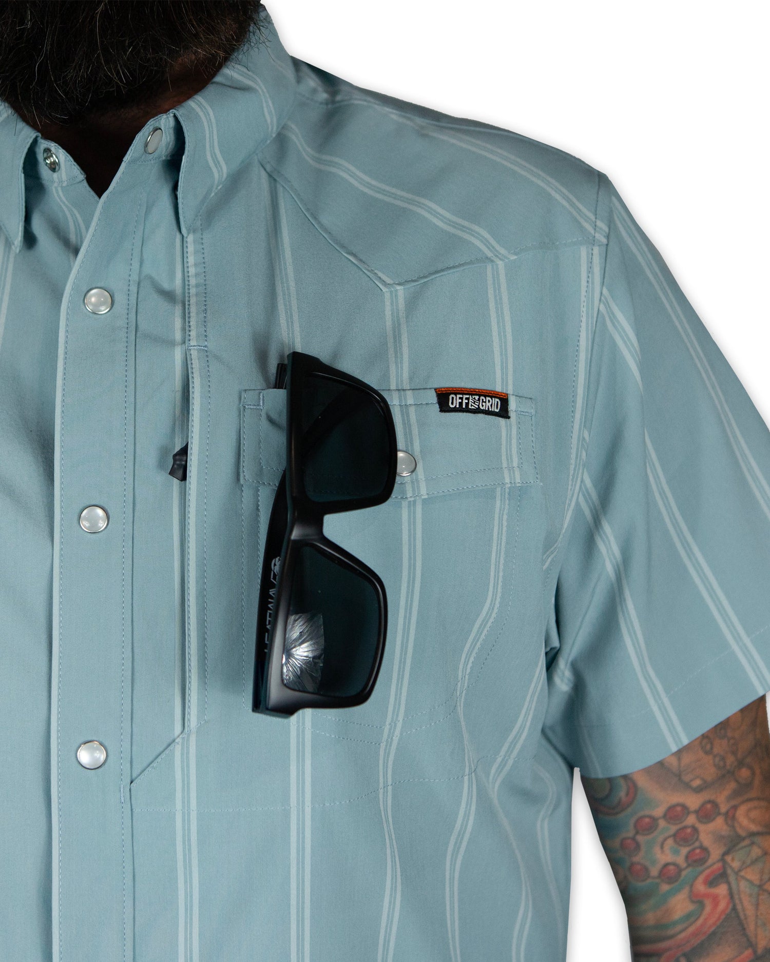 Mid blue Daryll SS shirt by Off The Grid Surplus, a stylish button-up shirt with a classic fit and clean design.