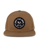 Black Off The Grid Surplus Jobsite Hat showing a sturdy cap with adjustable strap and logo patch on the front.
