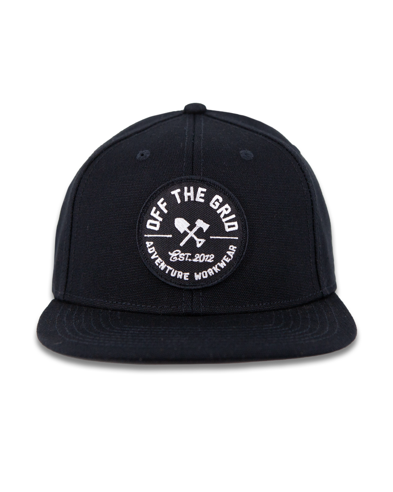 Black Off The Grid Surplus jobsite hat with a curved brim and adjustable strap, designed for durability and sun protection.