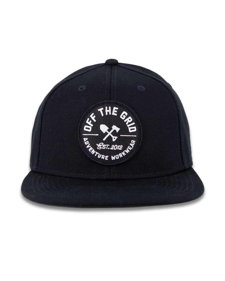 Black Off The Grid Surplus jobsite hat with a curved brim and adjustable strap, designed for durability and sun protection.