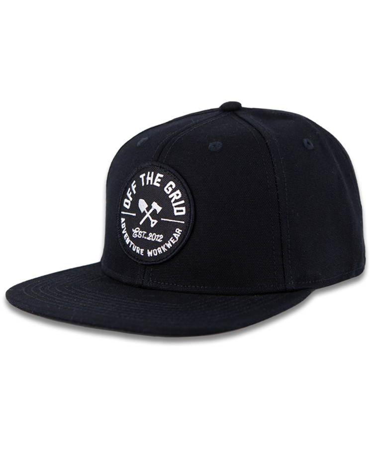 Black Off The Grid Surplus jobsite hat with adjustable strap and logo patch, designed for durability and outdoor work.