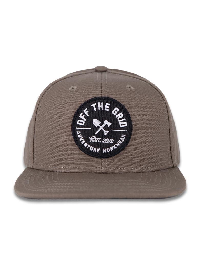 Black Off The Grid Surplus jobsite hat with adjustable strap and durable fabric, designed for work environments.