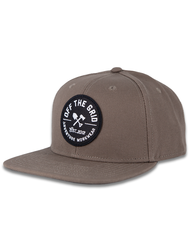Black Off The Grid Surplus Jobsite Hat featuring a structured brim and adjustable strap, designed for work and outdoor wear.