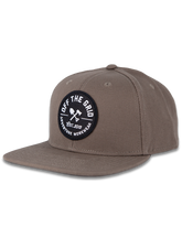 Black Off The Grid Surplus Jobsite Hat featuring a structured brim and adjustable strap, designed for work and outdoor wear.