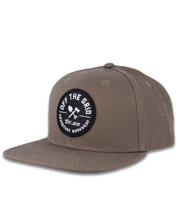 Black Off The Grid Surplus Jobsite Hat featuring a structured brim and adjustable strap, designed for work and outdoor wear.