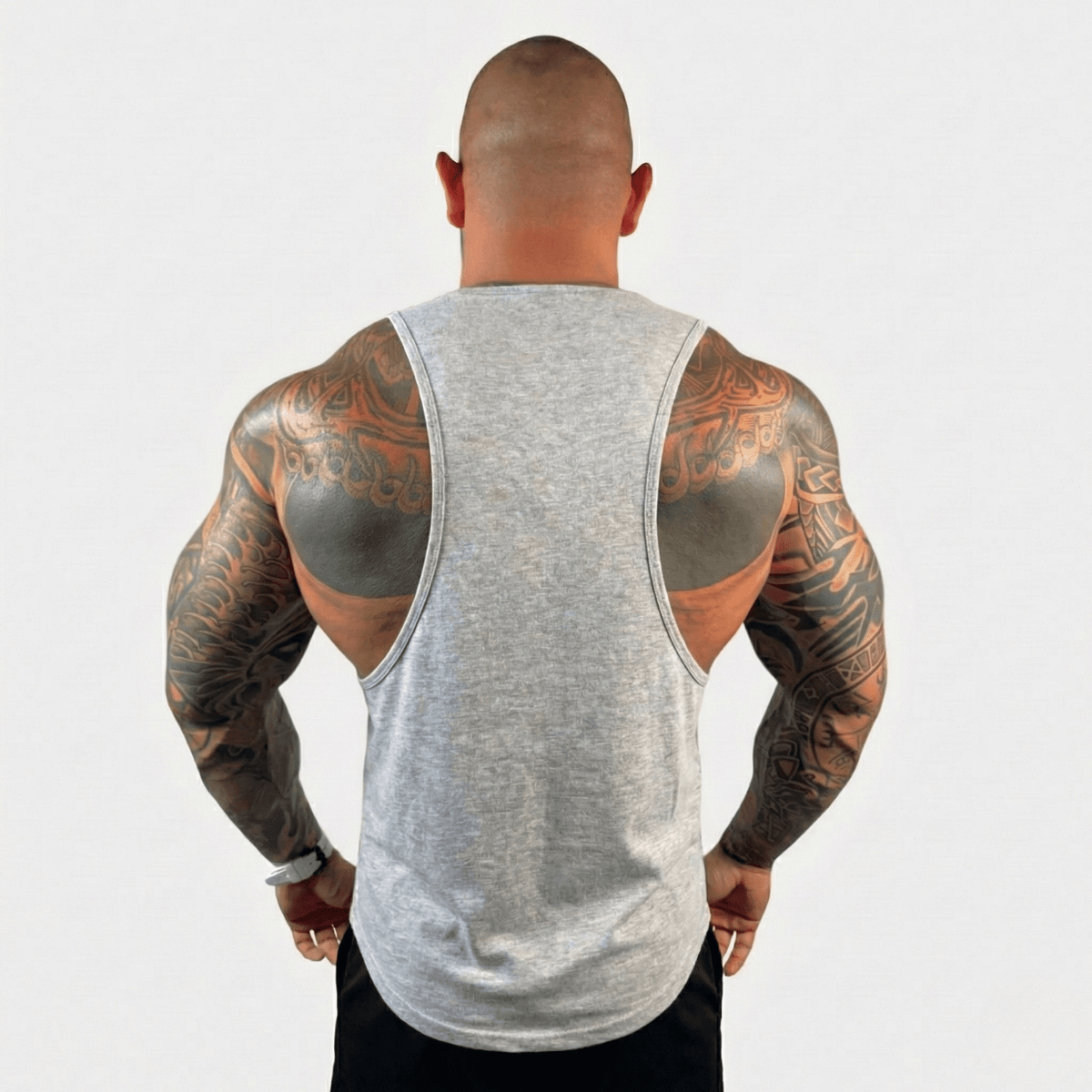 Black Physique Bodyware Drop Arm Tank Top with wide armholes, designed for athletic and casual wear.