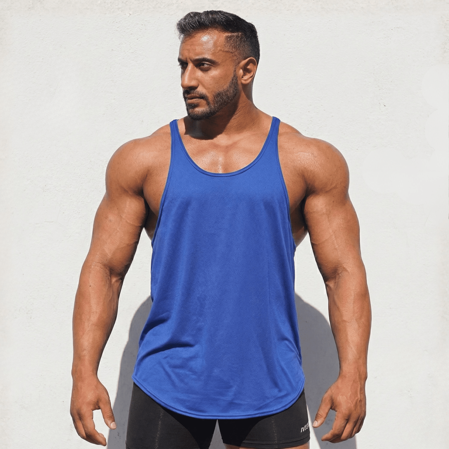 Black Physique Bodyware Stringer Tank Top for men, lightweight athletic top with minimal design and fitted style.
