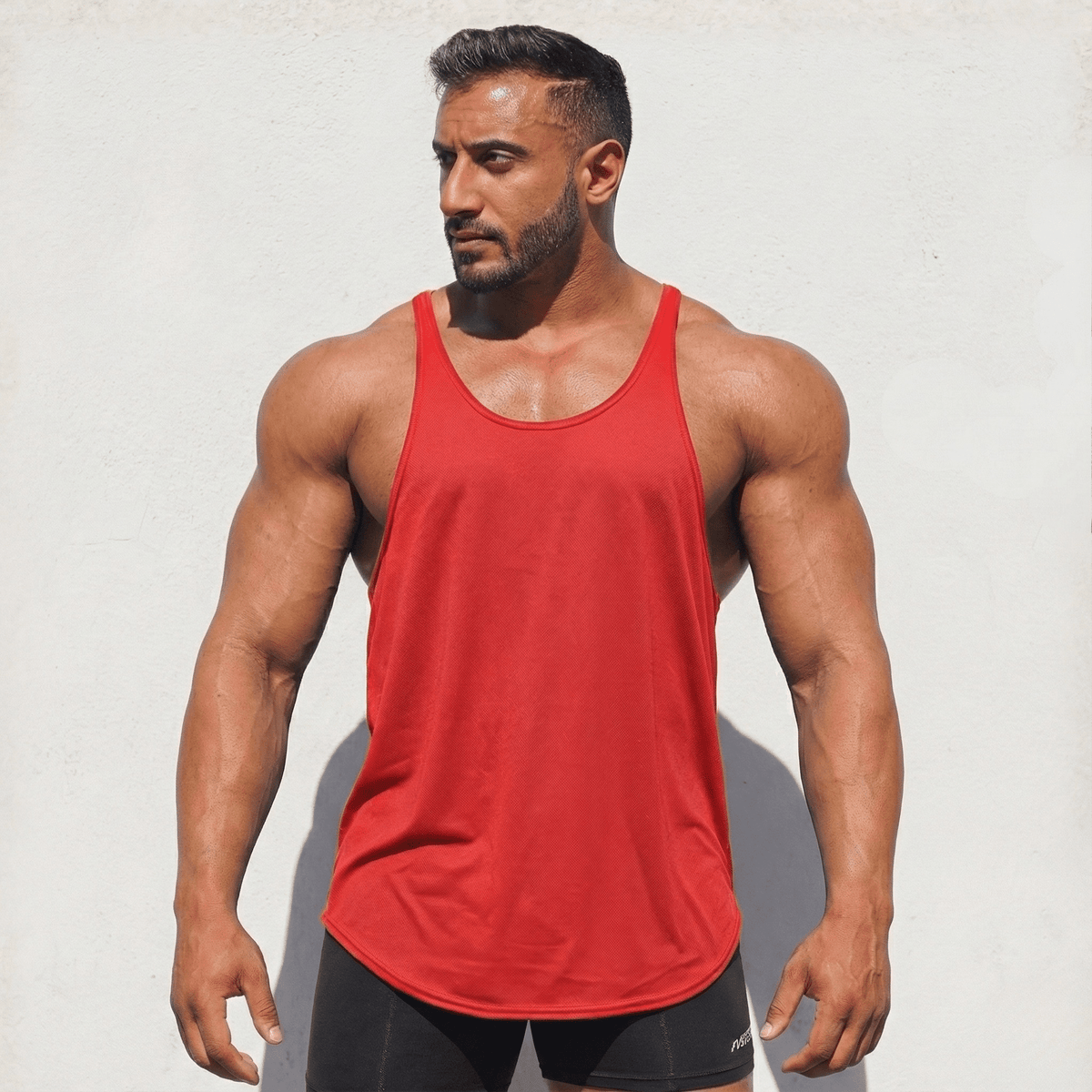 Black Physique Bodyware stringer tank top with slim fit design, ideal for gym workouts and athletic training.
