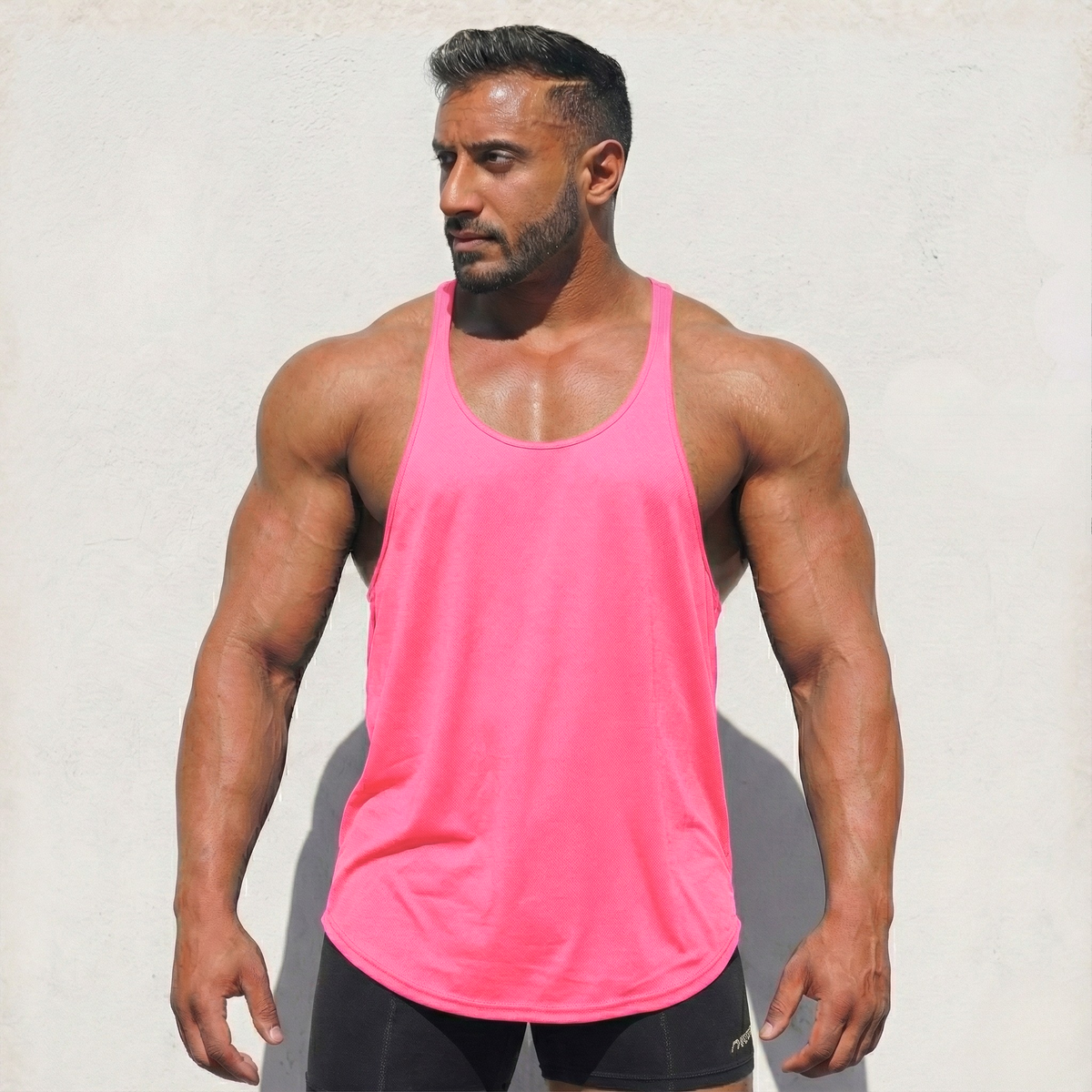 Black Physique Bodyware stringer tank top shown on a mannequin, highlighting its sleeveless design and fitted athletic style.