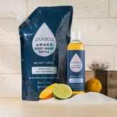 Puracy acidified, pH balanced citrus and sea salt body wash in a clear bottle with a pump dispenser.