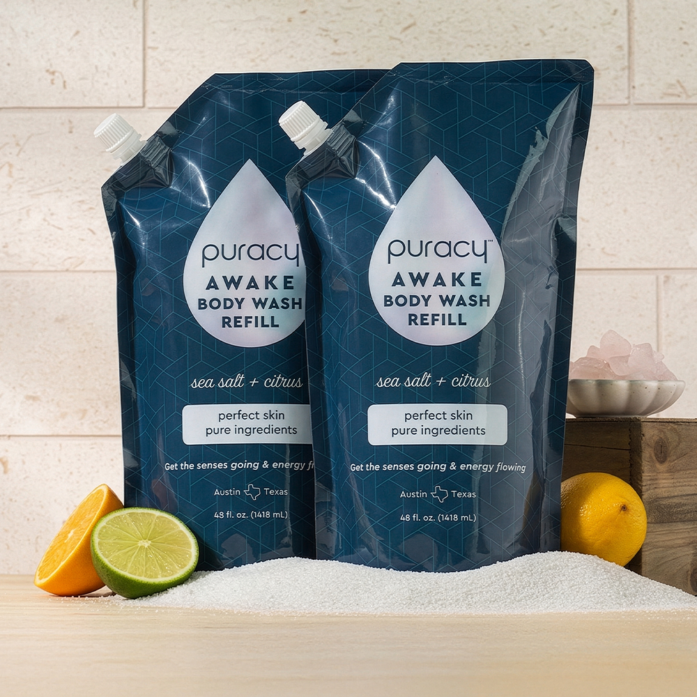 Puracy acidified, pH balanced citrus and sea salt body wash in a clear bottle with a pump dispenser.