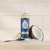 Puracy acidified, pH balanced citrus and sea salt body wash in a clear bottle showing the product label and vibrant citrus slices