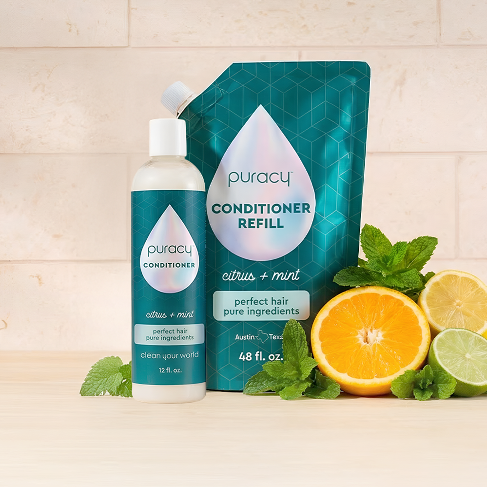 Puracy silicone and sulfate-free citrus mint conditioner bottle with green and white packaging.