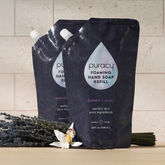 Puracy foaming hand soap bottles with lavender vanilla scent, packaged in a set of three, featuring pump dispensers and elegant labels.