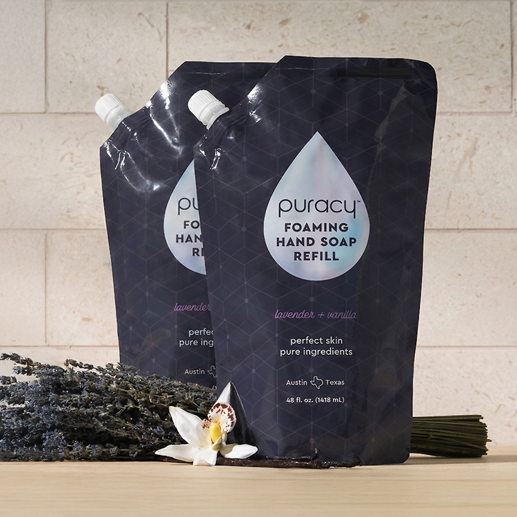 Puracy foaming hand soap bottles with lavender vanilla scent, packaged in a set of three, featuring pump dispensers and elegant labels.