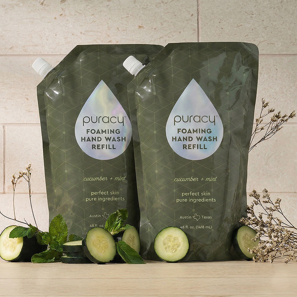 Puracy lavender vanilla foaming hand soap in a pump bottle, shown in a standard pack of three bottles, ready for handwashing.