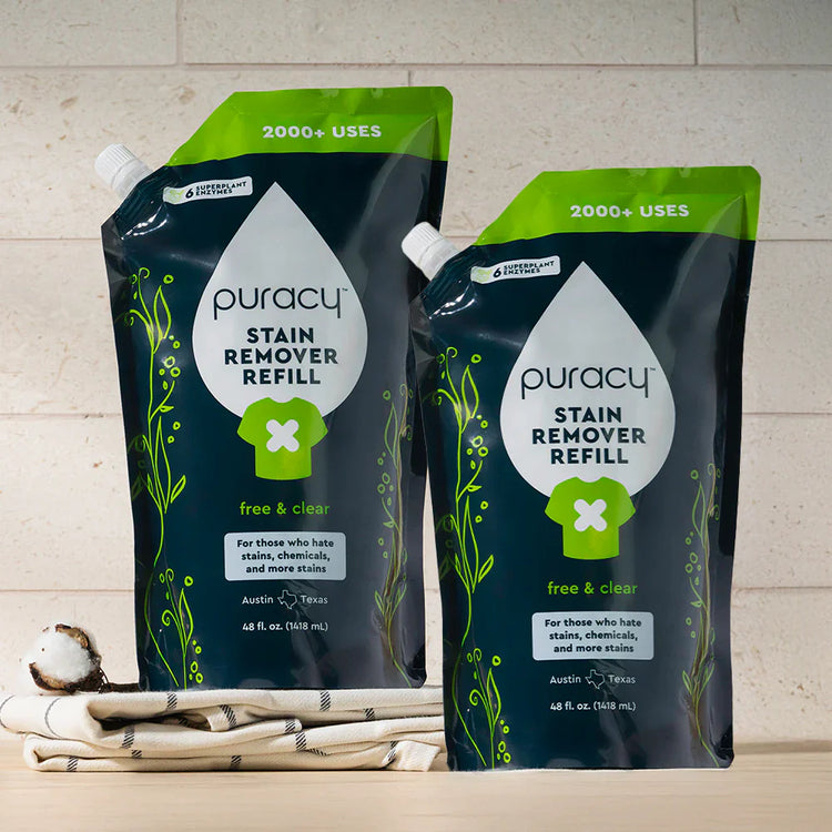 Puracy unscented laundry stain remover bottle showing stain removal brush and label for effective stain treatment.