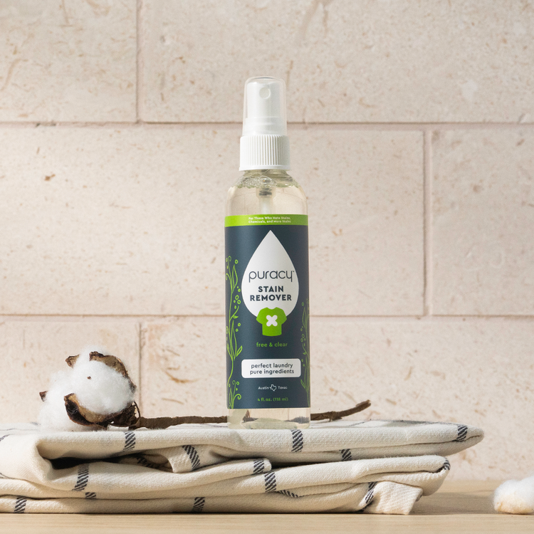 Puracy unscented laundry stain remover bottle, effective stain remover for clothing and fabrics, in a travel-sized container.