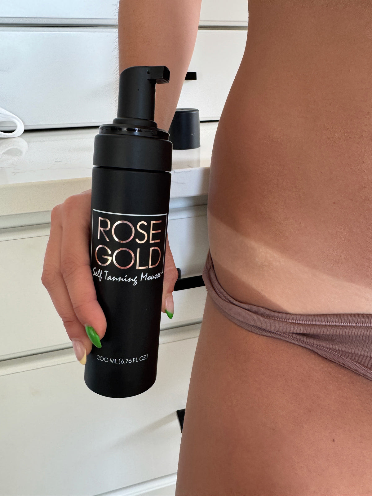 Rose Gold Sunless Rapid Rinse Self Tanning Mousse in dark neutral bronze, whipped foam formula for natural-looking tan application