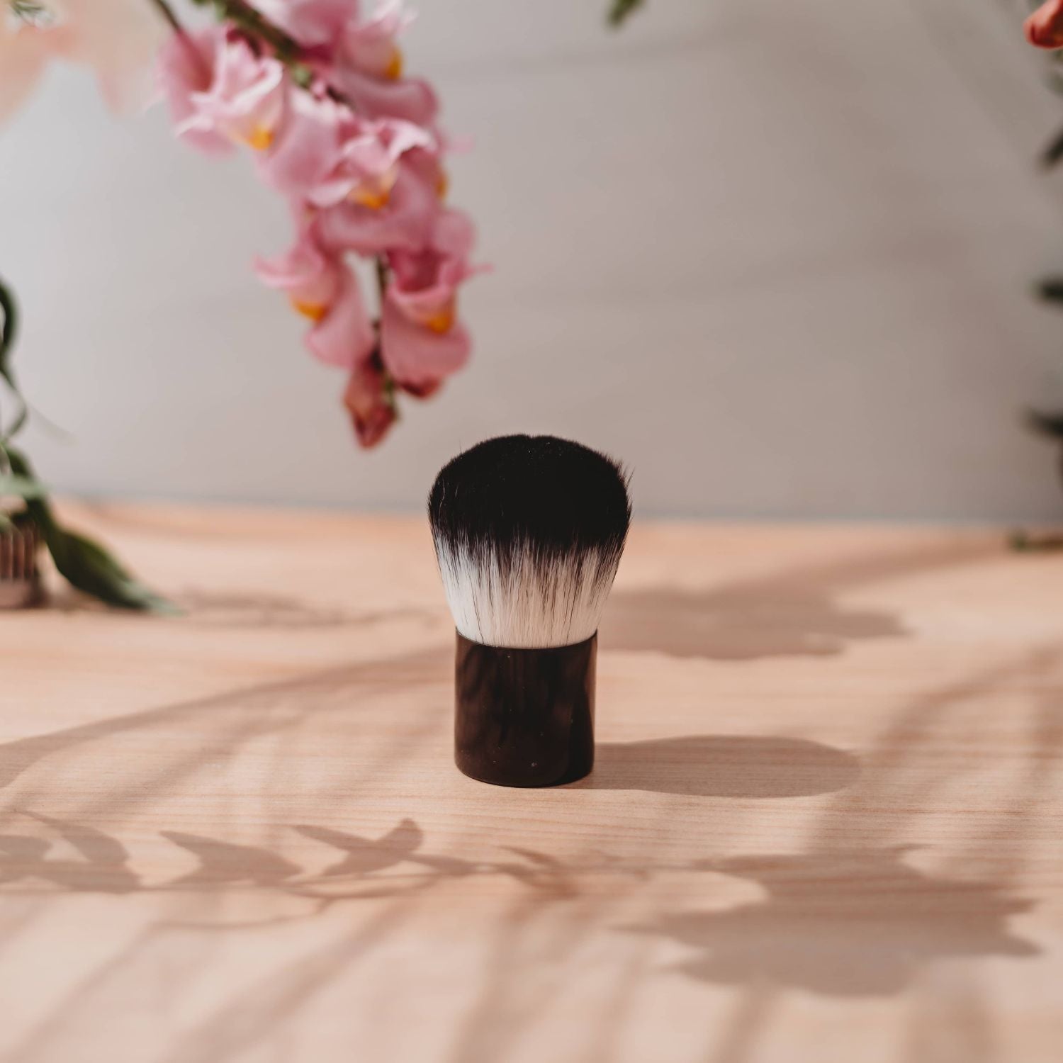 Rose Gold Sunless Kabuki Brush for self-tanner, precision blending tan applicator, soft brush for even application.