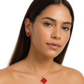 Farmacias Savia Pasión Red Clover enamel necklace and earrings jewelry set with vibrant red and green floral design.