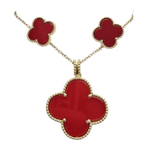 Farmacias Savia Pasión Red Clover jewelry set with enamel necklace and matching earrings, featuring vibrant red and green floral design.