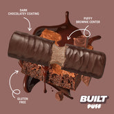 Stack of BUILT Brownie Batter Puff snacks showing a layered, textured chocolate puff with a rich, brownie-like appearance.