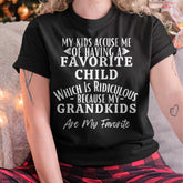 Black TEELUVS US 00 t-shirt with humorous "My kids accuse me of having a favorite child" graphic, perfect for grandmas.