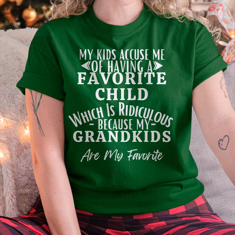 Black TEELUVS.com husband US 00 T-shirt featuring humorous text about grandkids and favorite children, worn by a man.