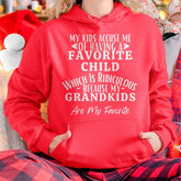 Black T-shirt for men with humorous text: "My kids accuse me of having a favorite child, but my grandkids are my favorite."