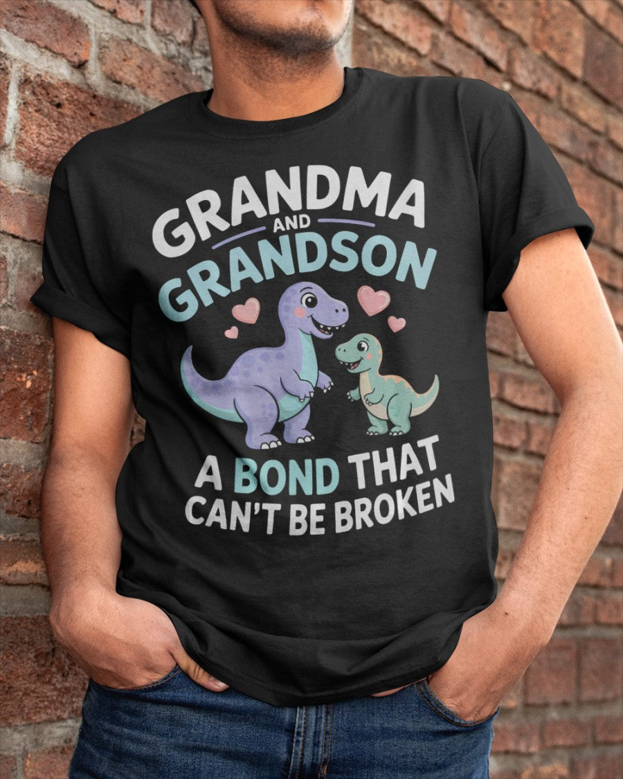 Black unisex dinosaur T-shirt from TEELUVS.COM featuring a grandma and grandson bond graphic, perfect for kids and family bonding.
