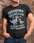 Black unisex dinosaur T-shirt from TEELUVS.COM featuring a grandma and grandson bond graphic, perfect for kids and family bonding.